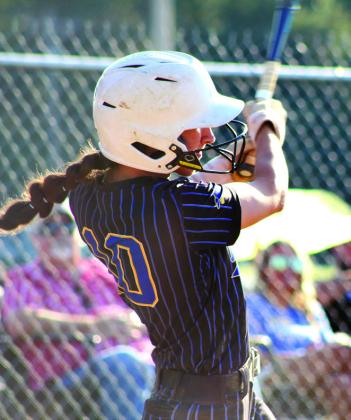 Left: Bethel senior Layla Menhusen dings a double in the Class 3A Regional Tournament game against Davis.