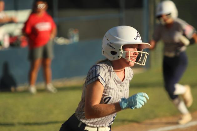 Asher senior Preslee Taylor runs to first after hitting a single, as her teammate sprints for home, during the home game against Wetumka on Sept. 22. The Lady Indians won that game, 8-0. They also won both of their Class B Fast Pitch District Tournament games with Maud on Sept. 25: 17-0 and 12-0. Natasha Dunagan, Countywide &amp; Sun