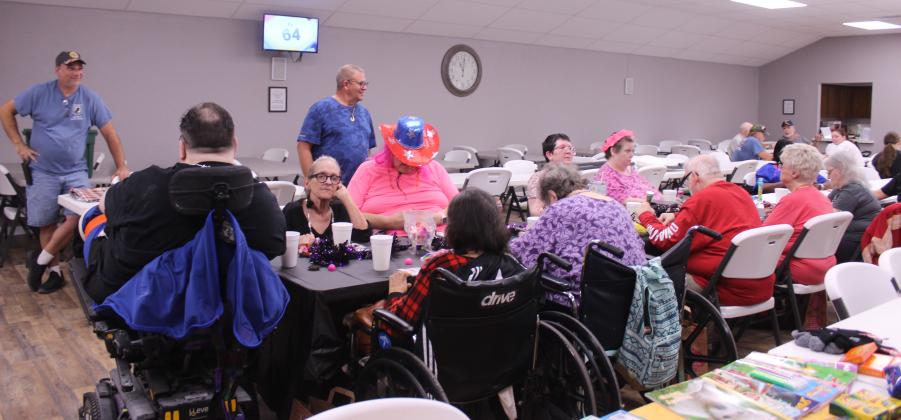 About 10 residents of Shawnee nursing homes, plus two nurses, enjoy a morning of bingo at American Legion Gill-Mattox Post 16 on Oct. 15, as Commander Keith DiPatri and Adjutant/Finance Officer Richard Filbert, both standing, wait to assist with bingo cards and prizes.