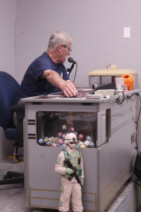 Jerry Dietrich calls out bingo numbers during a special monthly bingo event for nursing home residents at American Legion Gill-Mattox Post 16 in Shawnee on Oct. 15.