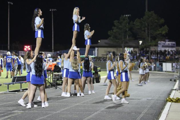 The Bethel High School Cheerleaders rally the crowd during the home football game against Prague on Sept. 26. The Wildcats won, 58-6.
