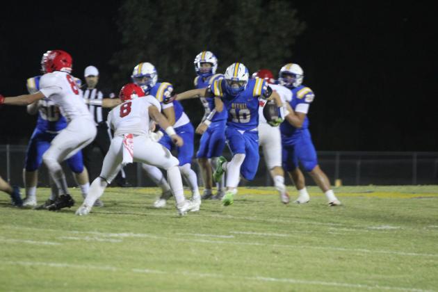 Bethel senior Luke Quinter gains eight yards on a carry for a third down and two during the home game against Prague on Sept. 26. The Wildcats won, 58-6.