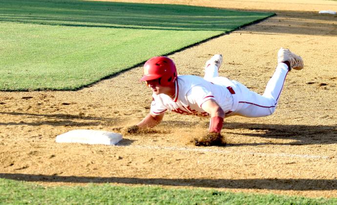 Dale's Andrew Collins hustles back to first base as the pitcher attempts to throw him out. Dale beat Byng 11-3 at home on Sept. 25. Julie Talton, Countywide &amp; Sun