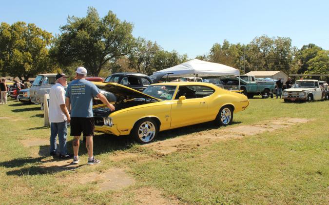 There were 60 cars entered in the Frontier Days Car Show, and the 1970 Oldsmobile Rally 350, in the foreground, owned by Richard Hicks, won Best in Show. The show was held in the empty lot east of Tecumseh First Assembly of God.