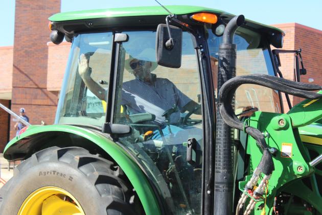 Oklahoma State Representative Danny Sterling waves from his tractor during the Frontier Days Parade on Sept. 27.