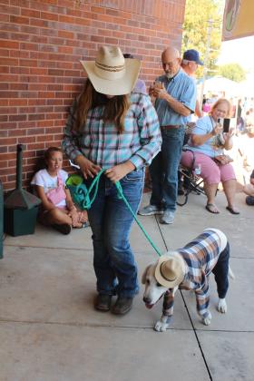 Justice McCormick and Gunner, both of Maud, compete in the "Best Dressed" division of the Frontier Days Pet Show at Tecumseh City Hall on Sept. 27. Caden McCormick and River, dressed in camouflage, took second.