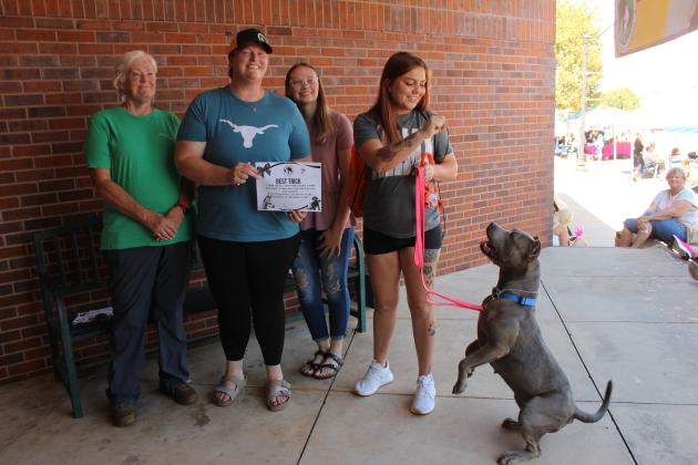 Rolly and owner Jessica James of OKC receive second place for Best Trick at the Frontier Days Pet Show on Sept. 27. The judges were Laurie Snyder, Katie Snyder Jones, DVM, and Kamea King.