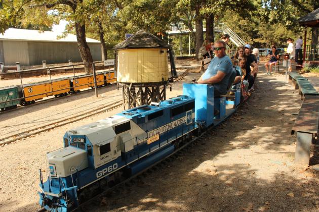 Engineer Brian Lacock waits for people to board the train pulled by a 1/8-scale diesel engine at the Locomotive Operators of Central Oklahoma facility on Oct. 5. LOCO is a non-profit train club, located west of Shawnee's Twin Lakes on Lake Drive, and is open for public rides on the first Sunday of each month, 1-4 pm.