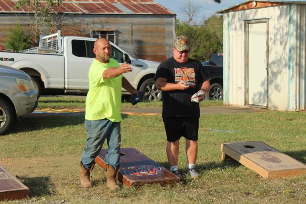 James Coleman, Jr., and Thomas Goodson practice for the cornhole tournament held at Macomb Trade Days on Sept. 25. The tournament was a fundraiser for Macomb Athletics, such as the fast pitch softball team. Head Softball Coach and Athletic Director Jimmy Hancock said the team won their District Tournament on Sept. 24, and there will be a golf tournament fundraiser on Oct. 4 at the Jimmie Austin Golf Course in Seminole. Natasha Dunagan, Countywide &amp; Sun