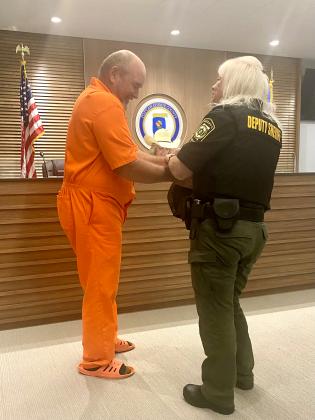 Deputy Griffin removes the handcuffs.