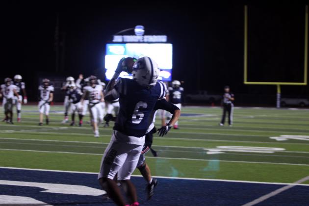 Shawnee senior Kedarrius Palmer catches a pass in the endzone during the third quarter of the Pink Out home game against Coweta on Oct. 10. The Wolves lost 14-38, for a record of 3-3.