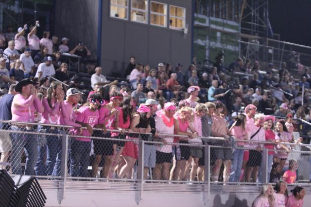 Shawnee High School students support the Wolves football team during the Pink Out home game against Coweta on Oct. 10.