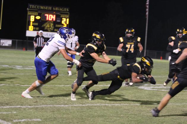 Tecumseh senior Jekhi Owens dives at the end of his run for more yardage during the second quarter of the Homecoming game against Harrah on Oct. 3. The Savages lost, 23-49. Natasha Dunagan, Countywide &amp; Sun