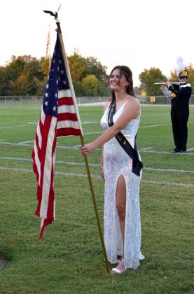 Tecumseh Queen Candidate &amp; Color Guard member, Adelaide Lack, holds the Flag during the National Anthem at Homecoming on Oct. 3. Julie Talton, Countywide &amp; Sun