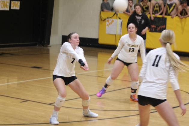 Tecumseh junior Katie Johnson makes a bump during the home match with Cache on Oct. 2. Also shown are fellow junior Lily Washburn (#13) and sophomore Kenzie Benge. The Lady Savages lost, 1-3. Natasha Dunagan, Countywide &amp; Sun