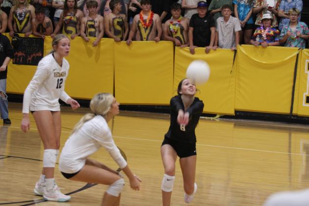 Tecumseh senior and libero Kayley Wood bumps the ball to keep it in play during the Senior Night home match with Cache on Oct. 2. Also shown are fellow senior Kennadee Mason (#12) and sophomore Kopelyn Taylor. Natasha Dunagan, Countywide &amp; Sun