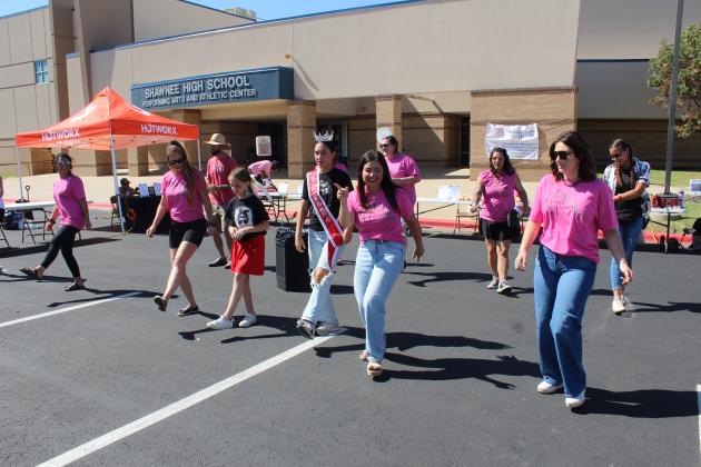 Worrel's Haven volunteers, Our Diamond Miss State Model Madison Gifford, and others dance to the "Cupid Shuffle" during the Second Annual Worrel's Haven Chili Cook Off, held in the Shawnee High School parking lot on Oct. 4. This year, the fundraiser had an "OU versus OSU" tailgating theme, and there were 18 types of chili on which attendees could vote. There were also 19 sponsors, and Jamelle Payne served as the master of ceremonies.