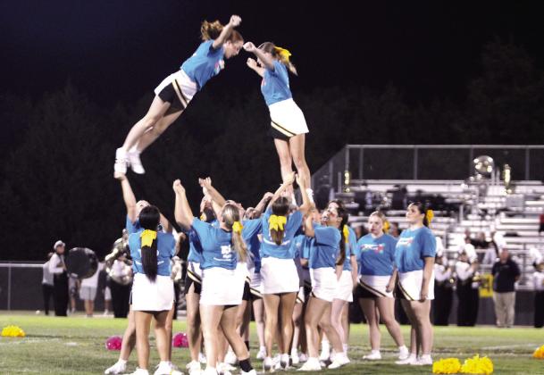 The Tecumseh High School Cheerleaders perform stunts during halftime of the Homecoming game with Harrah on Oct. 3. Natasha Dunagan, Countywide &amp; Sun