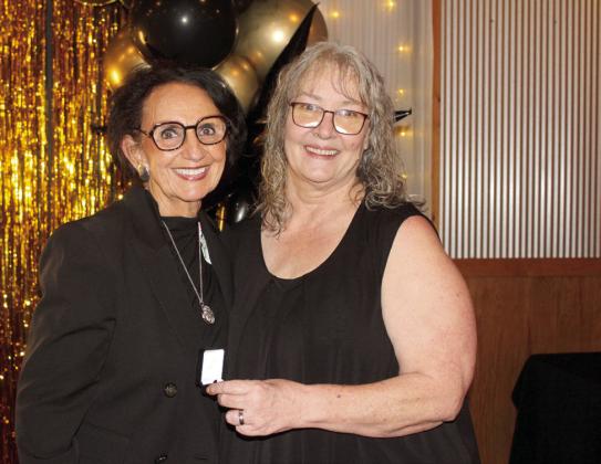 Suzie Campbell, Countywide &amp; Sun owner and publisher, presents a Pottawatomie Power Poll Top 10 award to CPN Vice Chair Linda Capps. Natasha Dunagan, Countywide &amp; Sun