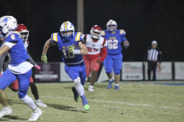 Bethel senior Luke Quinter makes his way to a touchdown during the Oct. 31 homecoming game, after escorting Homecoming Queen Lilly Jordan. The Wildcats won against Okmulgee 46-0. File photo by Natasha Dunagan, Countywide &amp; Sun