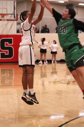 Earlsboro's Ezekiel Hatley makes his three-point shot during the first quarter of the Nov. 7 home game against Varnum. The Wildcats lost 35-53.