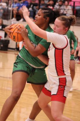 Earlsboro's Peighton Worley tries to steal during the fourth quarter of the Nov. 7 home game against Varnum. The Lady Wildcats lost 39-50.