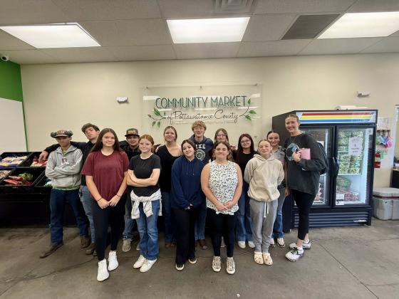 Members of Macomb FFA and their Advisor Tanna Southerland, far right, volunteered at the Community Market of Pottawatomie County in Shawnee on Nov. 5. McLoud FFA members have also donated time to the organization, and Macomb, McLoud and North Rock Creek are participating in the First United Bank "Harvesting Impact" program. Photo provided.