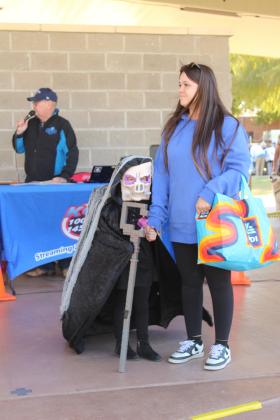 Jocelyn Dockrey, dressed as Malgosha from Minecraft, was one of the winners in the 4-7-year division of the Costume Contest at Shawnee's Fall Fest on Nov. 1 at Woodland Veterans Park. In the background, Derek Barton with KGFF served as the master of ceremonies.
