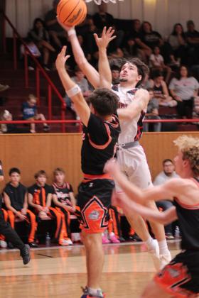 Macomb's Radlee Blaine tries for two points during the Nov. 18 home game against Wayne. The Hornets won 61-59.