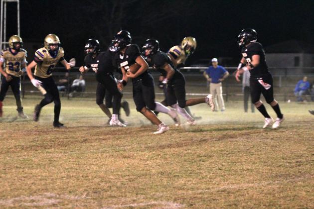 Maud freshman Jonathan Lamas steals the ball and makes it to the Bluejacket's 32-yard line during the Class C First Round Football Playoffs home game on Nov. 14. Lamas also made a touchdown before this play. The Tigers won 46-28 and will now play in the quarterfinals at Timberlake on Nov. 21 at 7 pm, according to www.ossaarankings.com. Natasha Dunagan, Countywide &amp; Sun