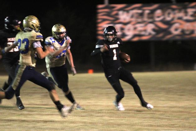 Maud sophomore Trenton Marshall carries the ball in the fourth quarter of the Class C First Round Football Playoffs home game against Bluejacket on Nov. 14. The Tigers won 46-28 and will now play in the quarterfinals at Timberlake on Nov. 21 at 7 pm, according to www.ossaarankings.com.