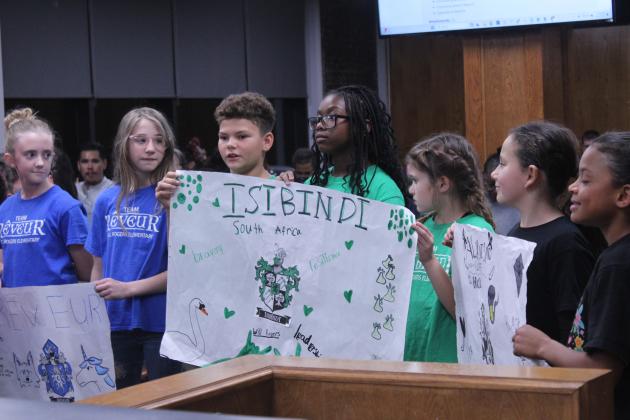 Will Rogers Elementary students speak about their Ron Clark houses - Reveur, Isibindi and Altruismo - during the Shawnee Board of Education meeting on Nov. 3. Shown are, from left, Aven Holt, Anabelle Drake, Grayson Carolina, Lyric Burnett, Peyton Neely, Khloe Cloud and Layla Kellogg.