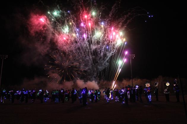 The Tecumseh, Meeker and North Rock Creek High School bands share the THS football field to play 'The Stars and Stripes Forever' by John Phillip Sousa, with a background of fireworks.
