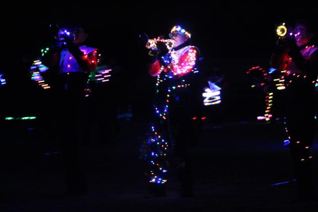 The North Rock Creek Marching Band takes their turn to perform their program bedecked in lights during the Veteran's Day Light Show, held at the Tecumseh football field on Nov. 11.