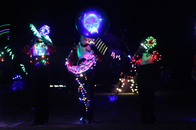 The North Rock Creek Marching Band takes their turn to perform their program bedecked in lights during the Veteran's Day Light Show, held at the Tecumseh football field on Nov. 11.