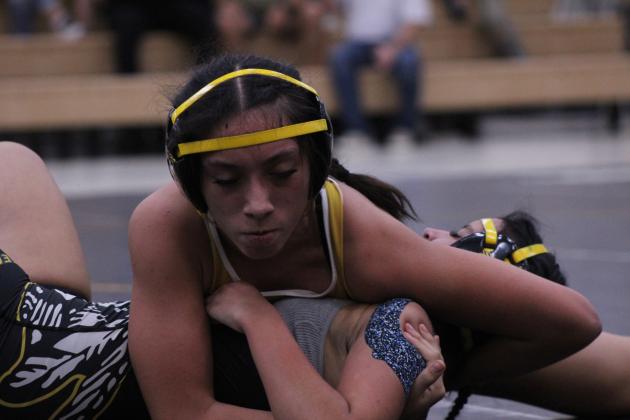 McKynzie Jim pins her opponent Madison Moore at Tecumseh's Black and Gold Dual held at the THS Alumni Center on Nov. 17.