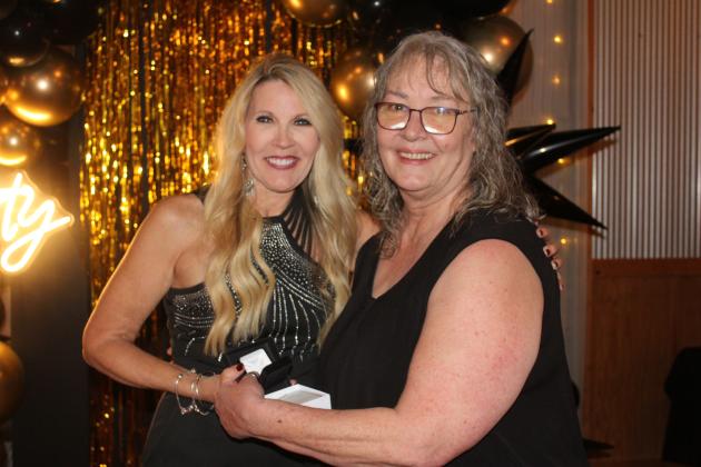 Countywide &amp; Sun Owner and Publisher Suzie Campbell, right, presents a Pottawatomie Power Poll Top 10 lapel pin to County Commissioner Melissa Dennis, who took the top spot during the Awards Gala on Oct. 24. Natasha Dunagan, Countywide &amp; Sun