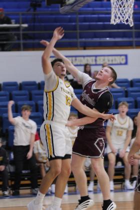 Tecumseh senior Creed Wright adds two points to the score during the Dec. 11 game against Eufaula in the Bethel First United Basketball Classic. The Savages edged Eufaula, 61-59; lost to Blanchard 46-67; and fell to McLoud, 55-56, in the consolation round of the three-day tournament. Natasha Dunagan, Countywide &amp; Sun