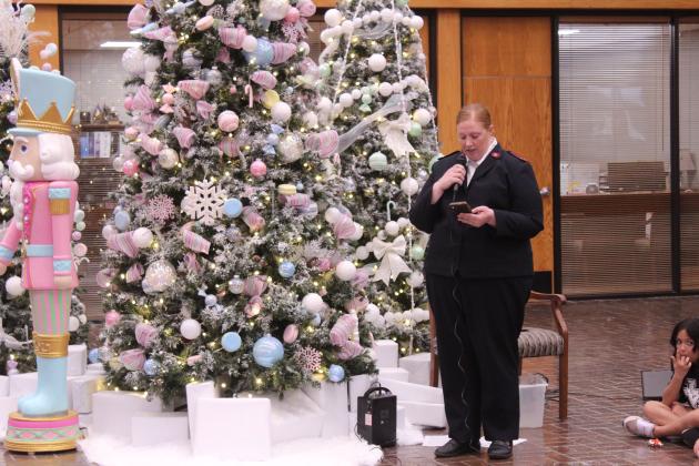 Salvation Army Co-Captain Leanna Marion speaks at the Angel Tree Kickoff event at Sovereign Bank on Nov. 20. Marion said she was an "Angel Tree kid," as well.