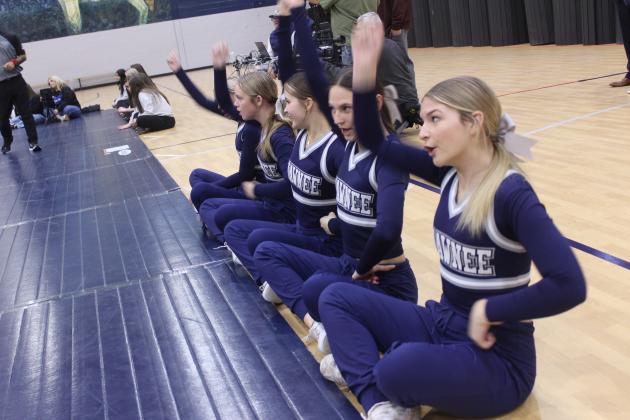 The Shawnee High School Mat Maids keep spirits high during the Shawnee High School Boys Dual against Newcastle on Dec. 2.