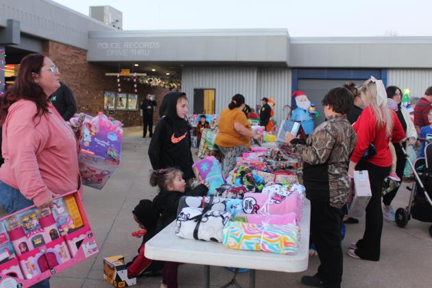 Children discover toys and blankets during the Fourth Annual Shawnee Police Department Toy Drive on Dec. 18.