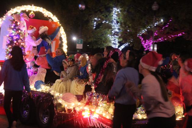 The Kindred Arts Collective float is full of light and smiles in the Shawnee Parade of Lights along Main Street on Dec. 12. According to State Representative Dell Kerbs, with Safe Events for Families, there were 117 entries in the two-hour parade.