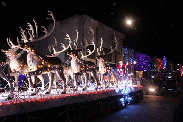 Santa Claus rides in his sleigh pulled by nine beautiful reindeer in the Shawnee Parade of Lights on Dec. 12. Santa and fireworks rounded out the two-hour parade with 117 entries.