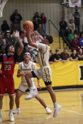 Tecumseh senior Creed Wright goes to the hoop and draws the foul during the Dec. 5 home game. Natasha Dunagan, Countywide &amp; Sun