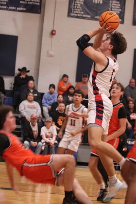 Asher's Hudson Skender shoots for the bucket but draws a foul in the Sat., Jan. 3, home game against Konawa. The Indians won 58-47.