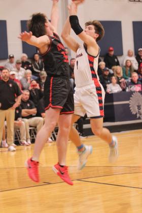 Asher's Hudson Skender puts up a jumper during the Jan. 16 home game against Vanoss. The Indians won 65-55.