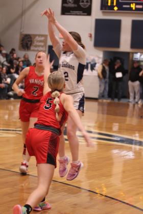 Asher's Makaylee Harrell tries for a trey in the fourth quarter of the Jan. 16 home game against Vanoss. The Lady Indians lost 28-58.