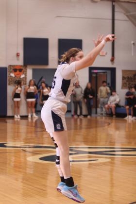 Asher's Payton Madinger tries for a three-pointer in the fourth quarter of the Jan. 3 home game against Konawa. The Lady Indians won 65-37, according to ossaarankings.com.