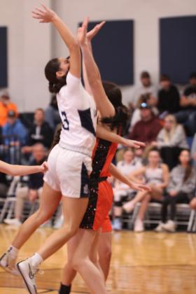 Asher's Kenzie Thompson makes her shot despite colliding with the Konawa defense during the Jan. 3 home game. The Lady Indians won 65-37, according to ossaarankings.com.