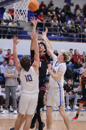 Dale junior Keldan Meely grabs the rebound and takes his shot, as Bethel's Luke Quinter and Stonie Holliday play defense, during the second quarter of the Jan. 20 Wildcats home game. The Pirates won 92-34.
